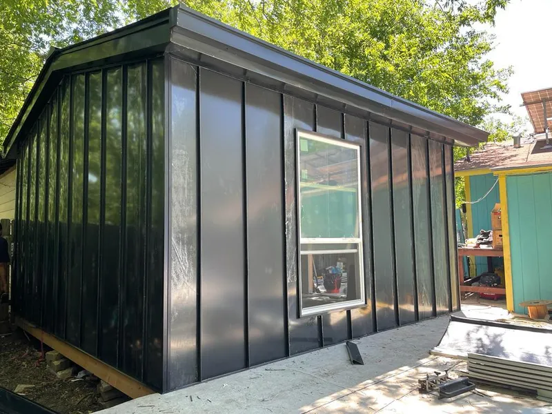 Black standing seam metal wall panels for Roof Inspection in La Plata