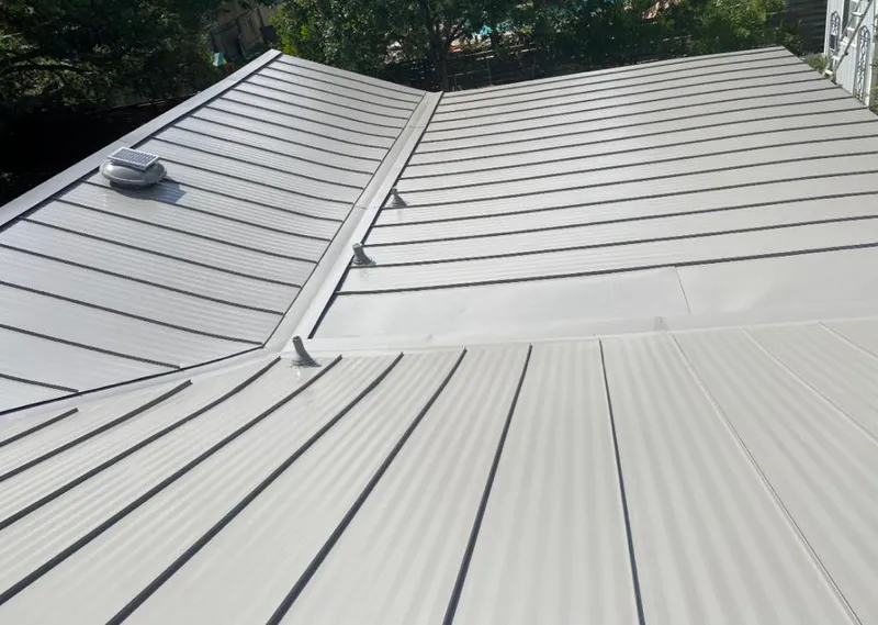Solar attic fan installed on a metal roof for Roof Ventilation in La Plata